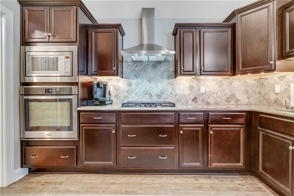 369 Saddlebrook Road Gibsonia, PA 15044 - Photo 8 of 25 Kitchen with Built-In Oven, Gas Cook Top & Stainless Range Hood