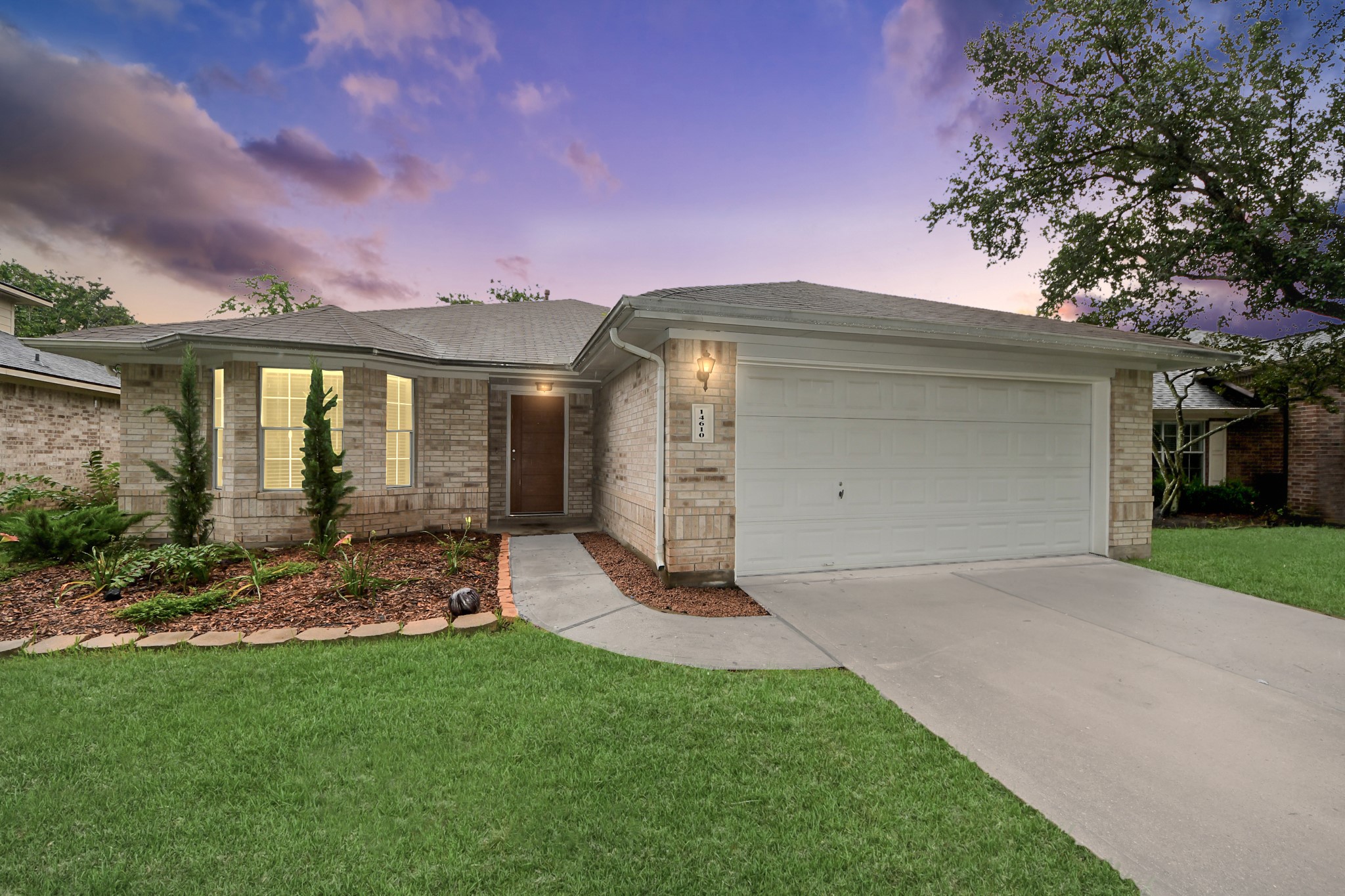 14610 Hazy Ridge Lane Cypress, TX 77429 - Photo 38 of 44 Beautiful twilight view showcases the home's stunning exterior as the setting sun casts a warm glow, highlighting its charm and exceptional curb appeal.