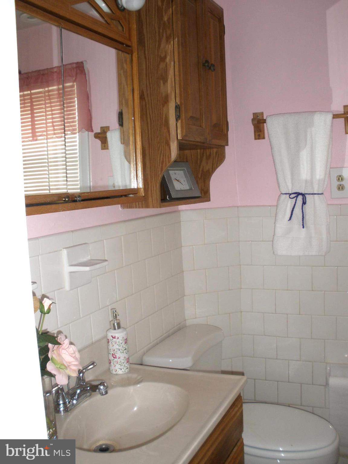 38 Kinship Road Baltimore, MD 21222 - Photo 20 of 38 a bathroom with a sink toilet and mirror