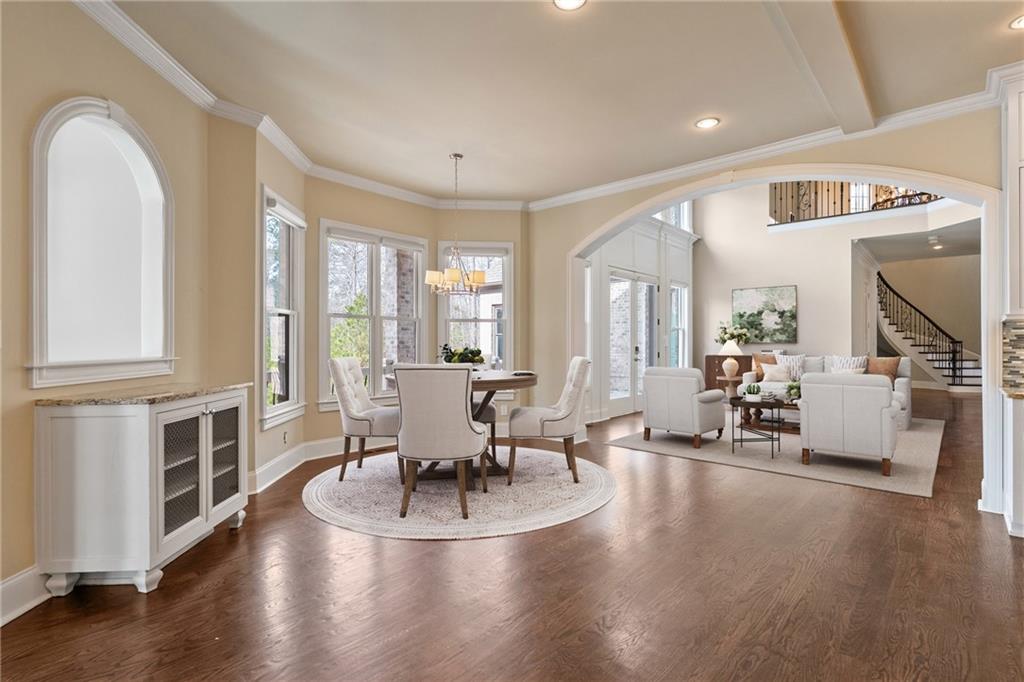 14560 Wood Road Milton, GA 30004 - Photo 21 of 74 a living room with fireplace furniture and a wooden floor