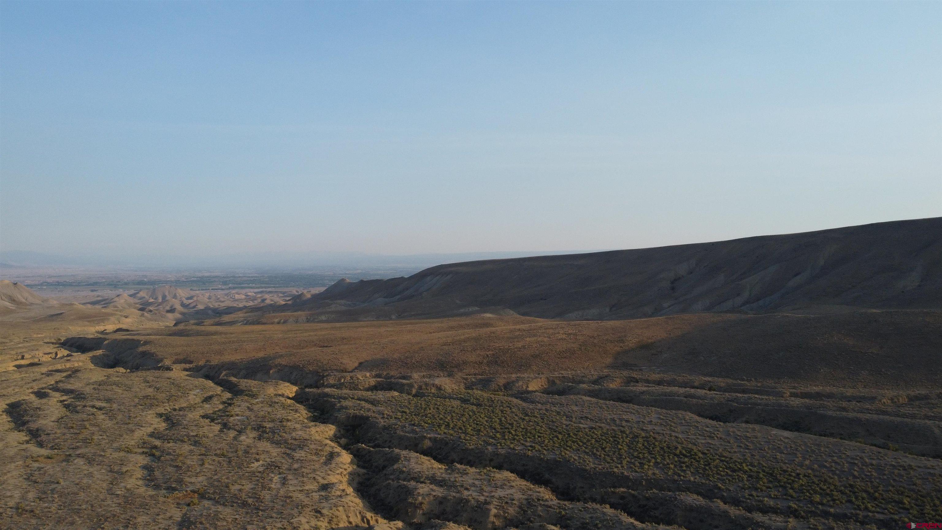 2 West Pipeline Road Delta, CO 81416 - Photo 2 of 4 a view of an ocean beach and mountain