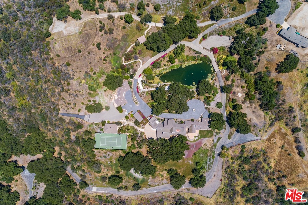 an aerial view of house with yard