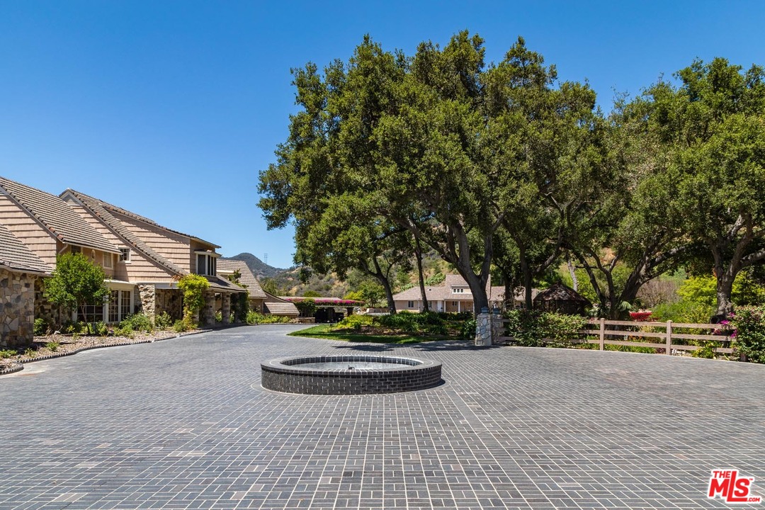 3100 Mandeville Canyon Road Los Angeles, CA 90049 - Photo 23 of 27 a view of street with houses
