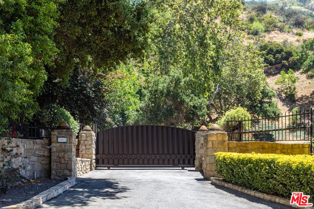 3100 Mandeville Canyon Road Los Angeles, CA 90049 - Photo 4 of 27 a view of swimming pool with a patio