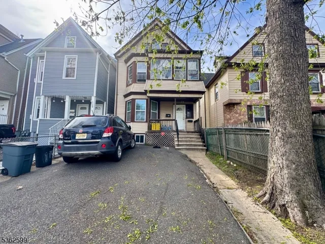 a view of building with car parked