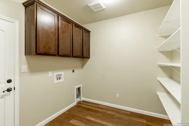 a view of an entryway with wooden floor