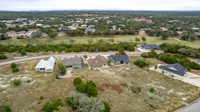 an aerial view of residential house with outdoor space