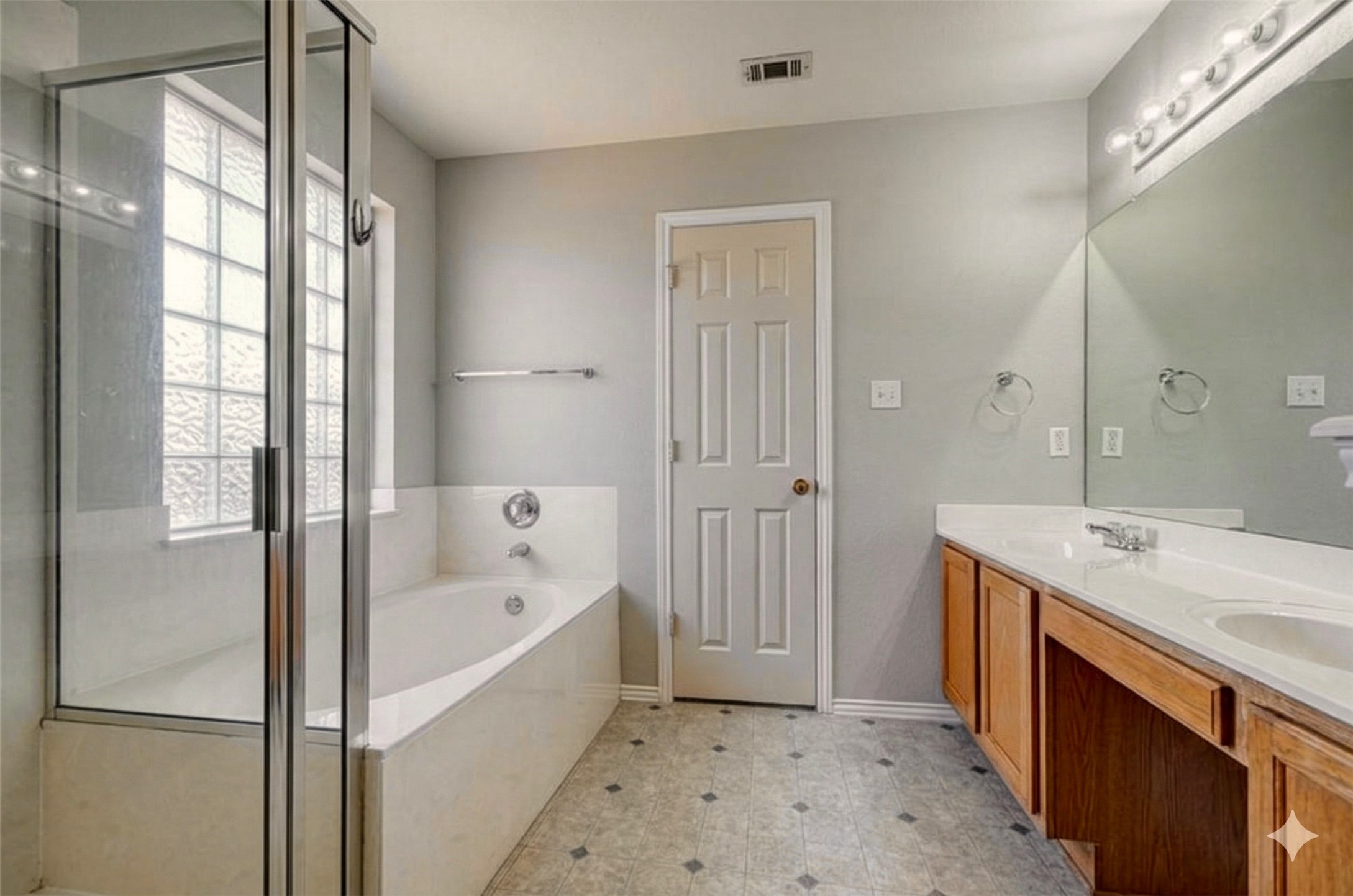 15543 Miss Adrienne's Path Pflugerville, TX 78660 - Photo 5 of 9 a bathroom with a bathtub and a sink