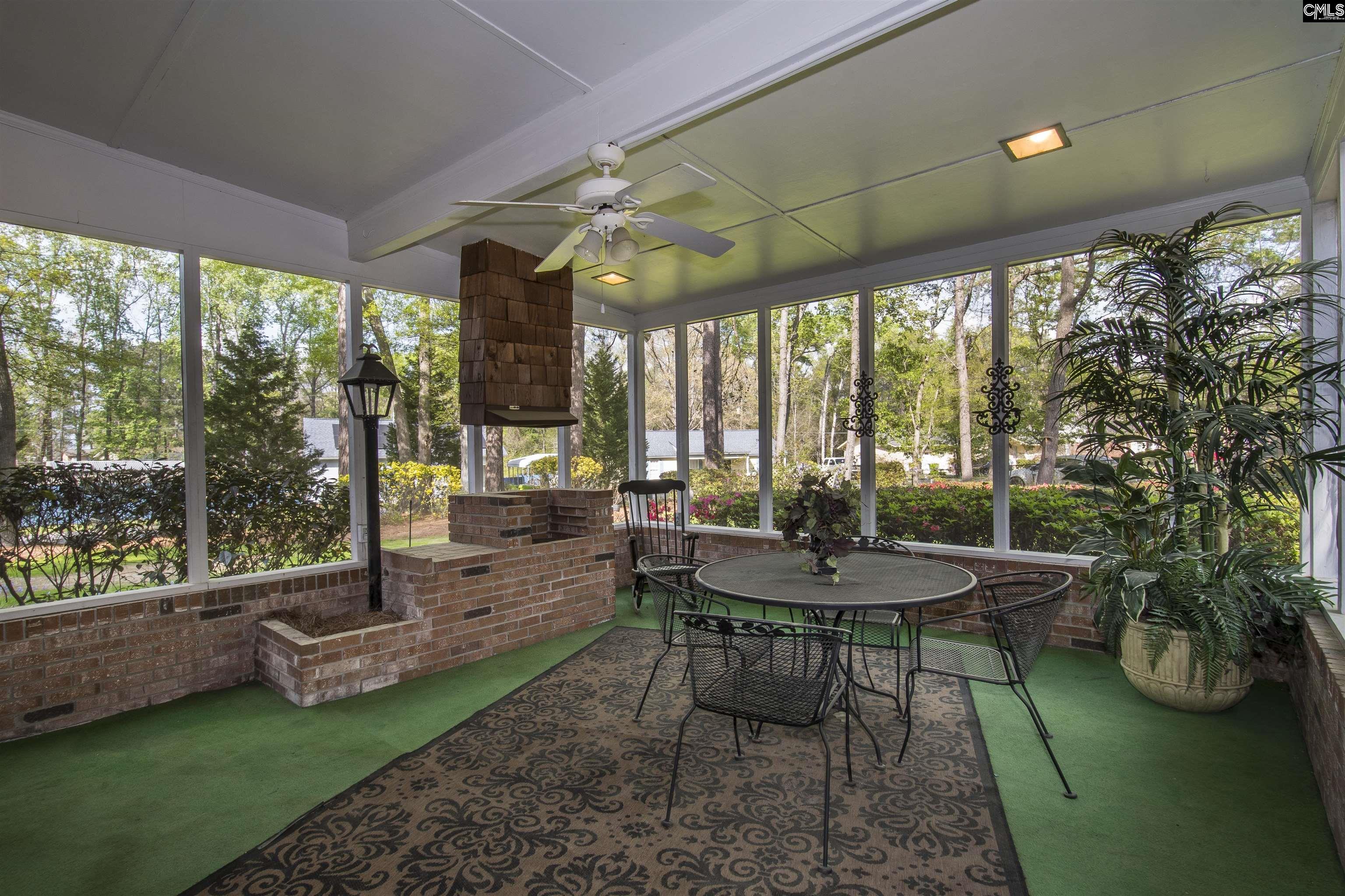 2309 Cunningham Road Columbia, SC 29210 - Photo 32 of 41 a view of a patio with a table chairs and a backyard