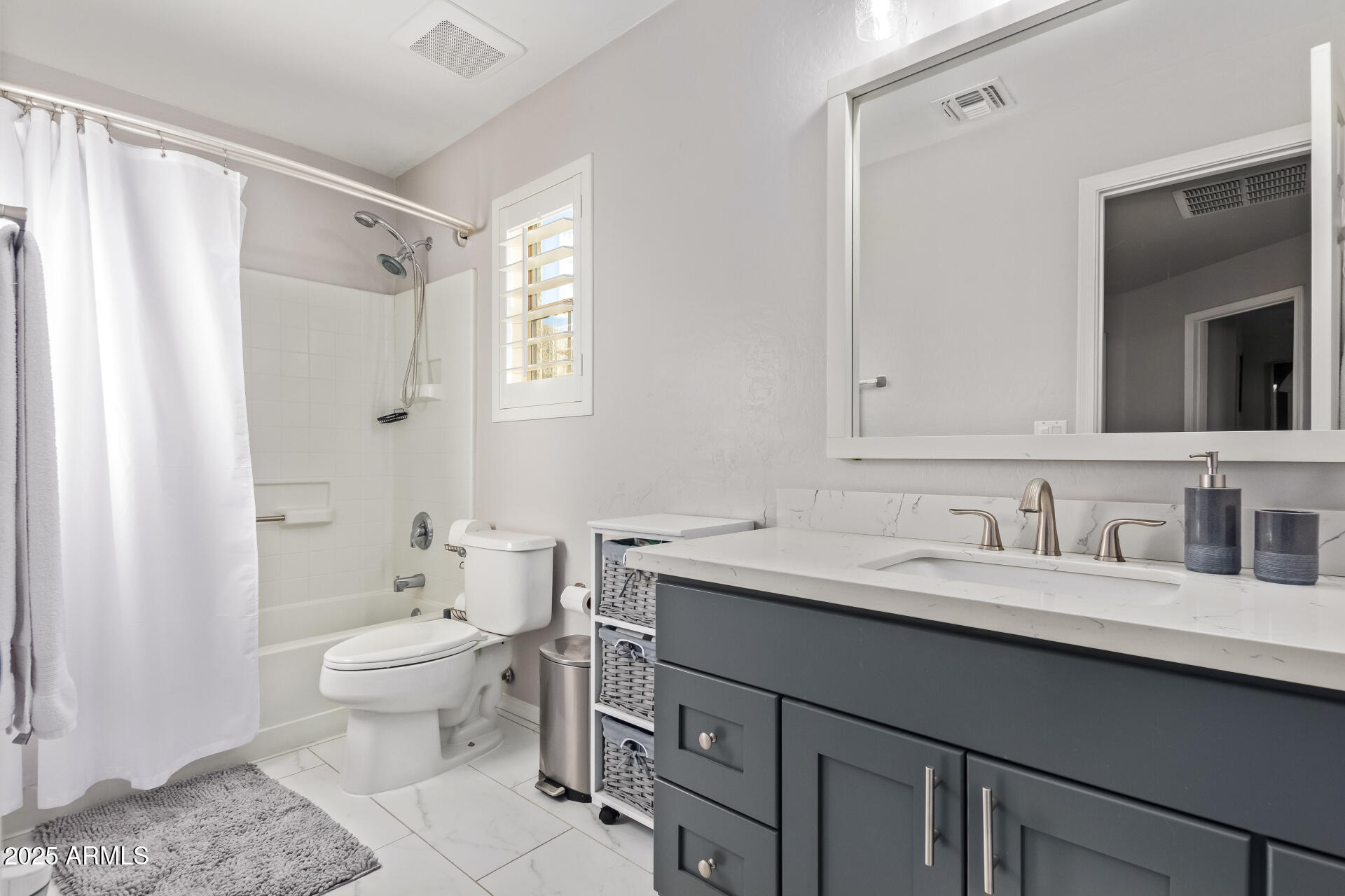 2921 South Martingale Road Gilbert, AZ 85295 - Photo 41 of 67 a bathroom with a granite countertop sink toilet a mirror and shower