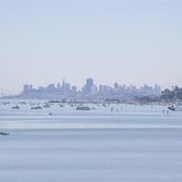 a living room with furniture rug and a window