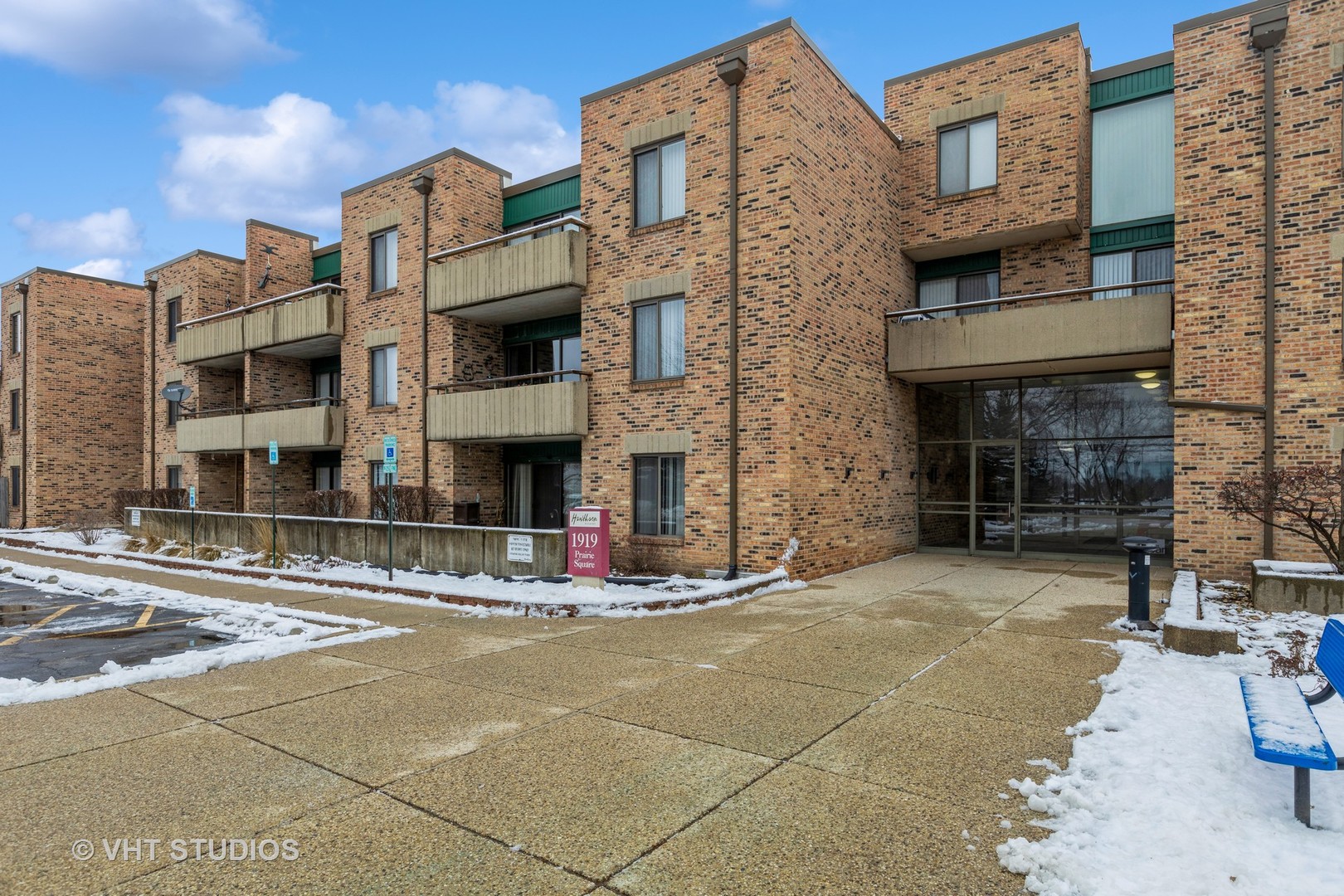 1919 Prairie Square, Unit 133 Schaumburg, IL 60173 - Photo 2 of 14 a brick building with a large windows