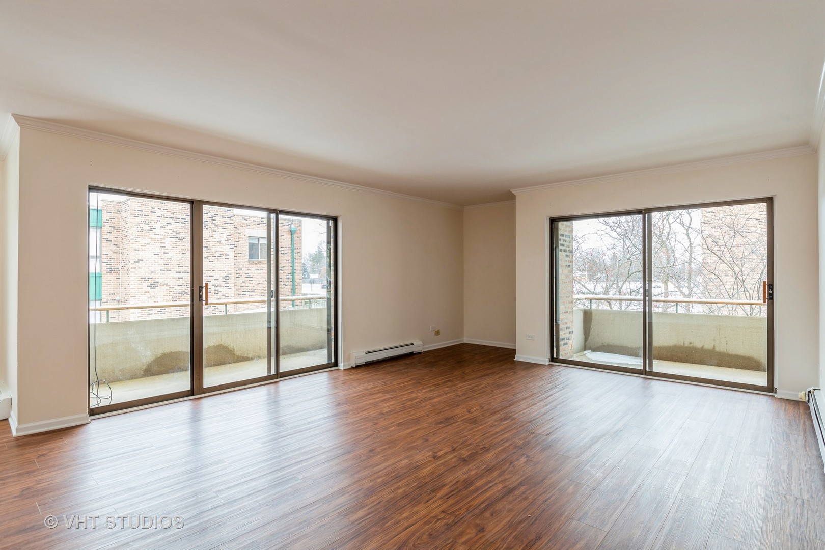 1919 Prairie Square, Unit 133 Schaumburg, IL 60173 - Photo 3 of 14 wooden floor in an empty room with a window