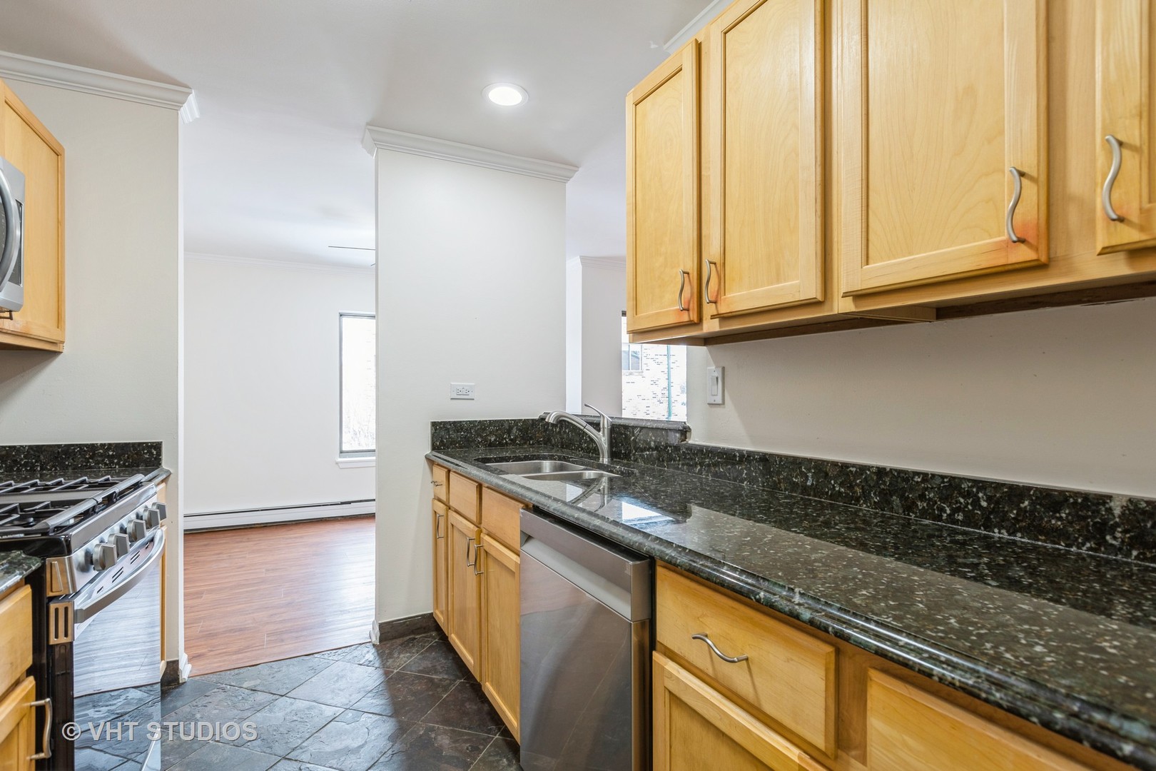 1919 Prairie Square, Unit 133 Schaumburg, IL 60173 - Photo 8 of 14 a kitchen with granite countertop a sink and a stove