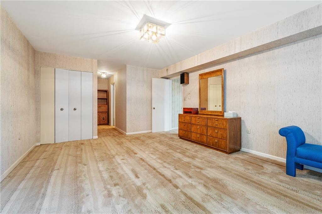 302 Fox Chapel Road, Unit 401 Pittsburgh, PA 15238 - Photo 12 of 25 a bedroom with a bed and furniture