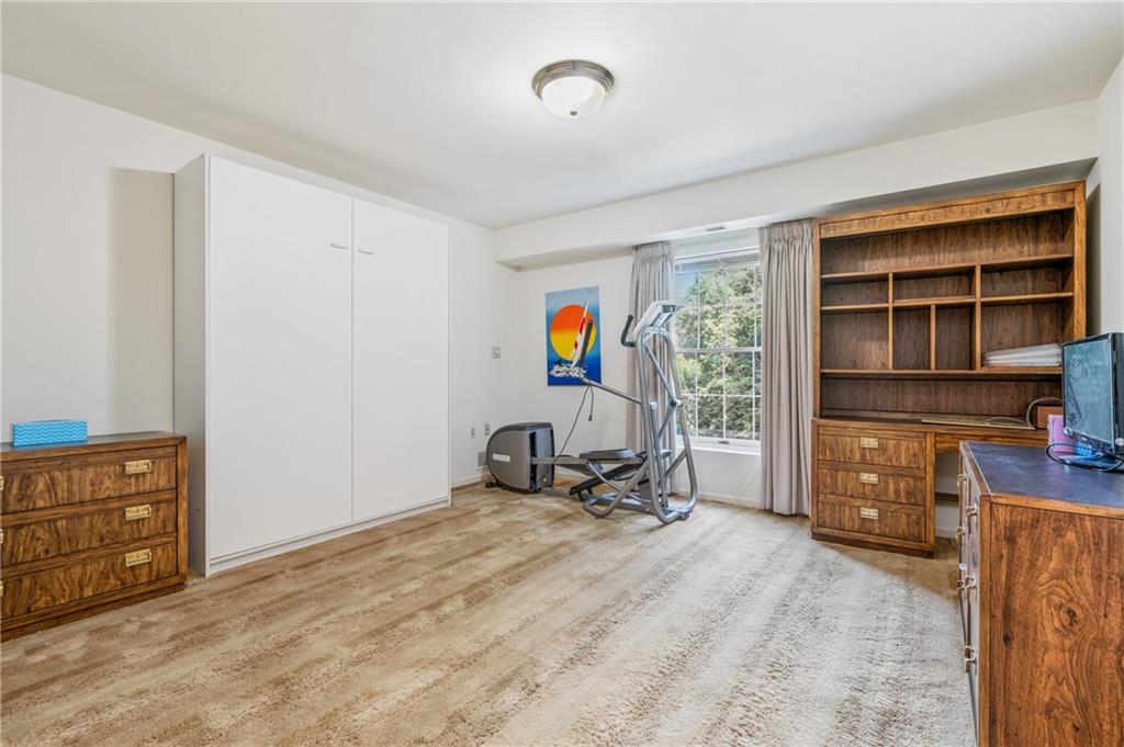 302 Fox Chapel Road, Unit 401 Pittsburgh, PA 15238 - Photo 16 of 25 a living room with furniture and a window