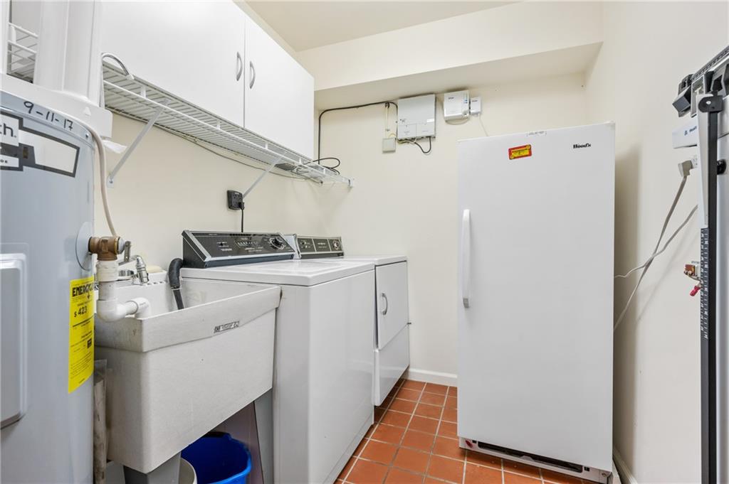 302 Fox Chapel Road, Unit 401 Pittsburgh, PA 15238 - Photo 18 of 25 a utility room with dryer and washer