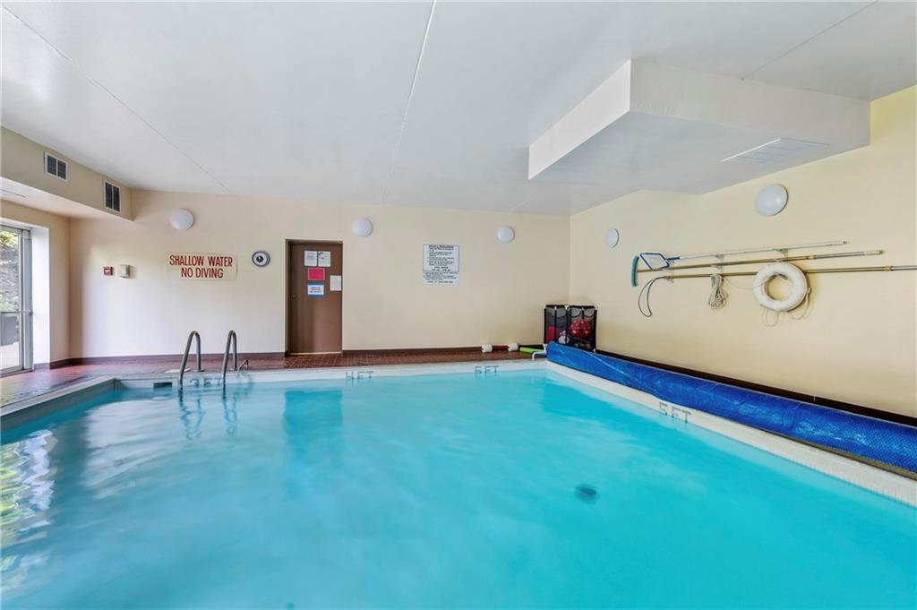 302 Fox Chapel Road, Unit 401 Pittsburgh, PA 15238 - Photo 24 of 25 a room with lots of furniture and white walls