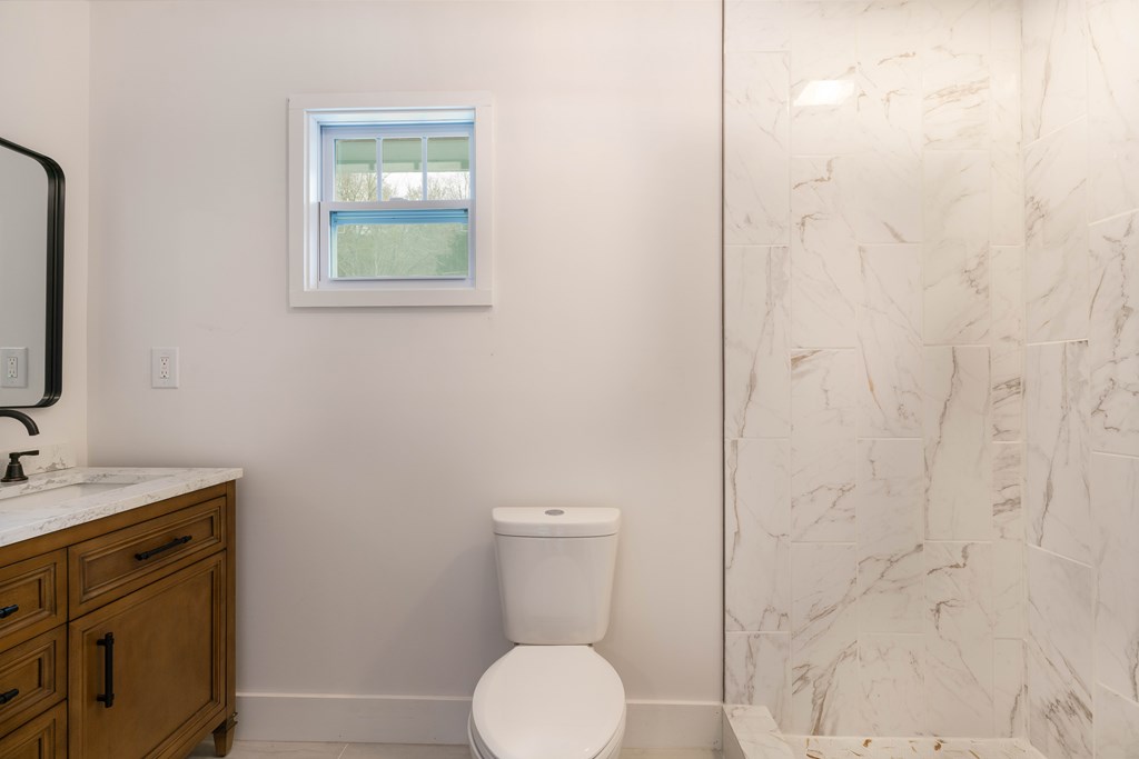 5107 Boiling Springs Road Murphy, NC 28906 - Photo 15 of 35 a bathroom with a toilet sink and mirror