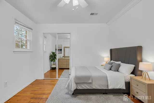 a bedroom with a bed and a lamp