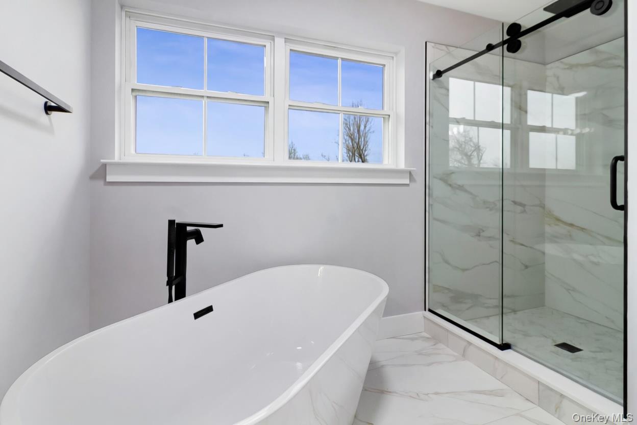 800 Sleepy Hollow Road Briarcliff Manor, NY 10510 - Photo 11 of 15 a bathroom with a tub and shower