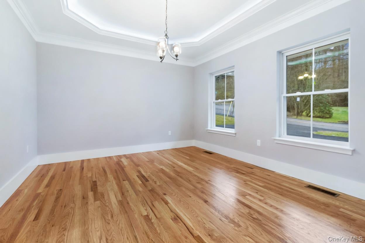 800 Sleepy Hollow Road Briarcliff Manor, NY 10510 - Photo 12 of 15 a view of an empty room with wooden floor and a window