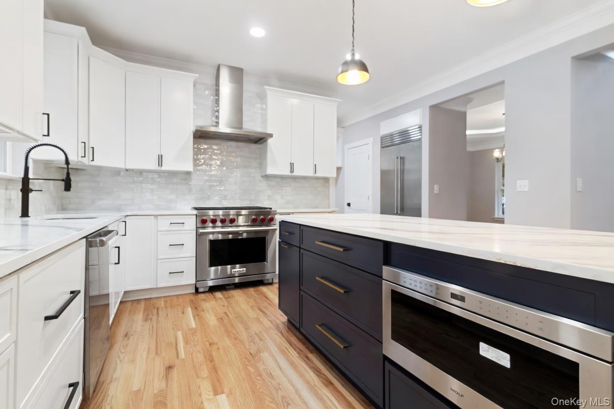 800 Sleepy Hollow Road Briarcliff Manor, NY 10510 - Photo 8 of 15 a kitchen with wooden floors and appliances