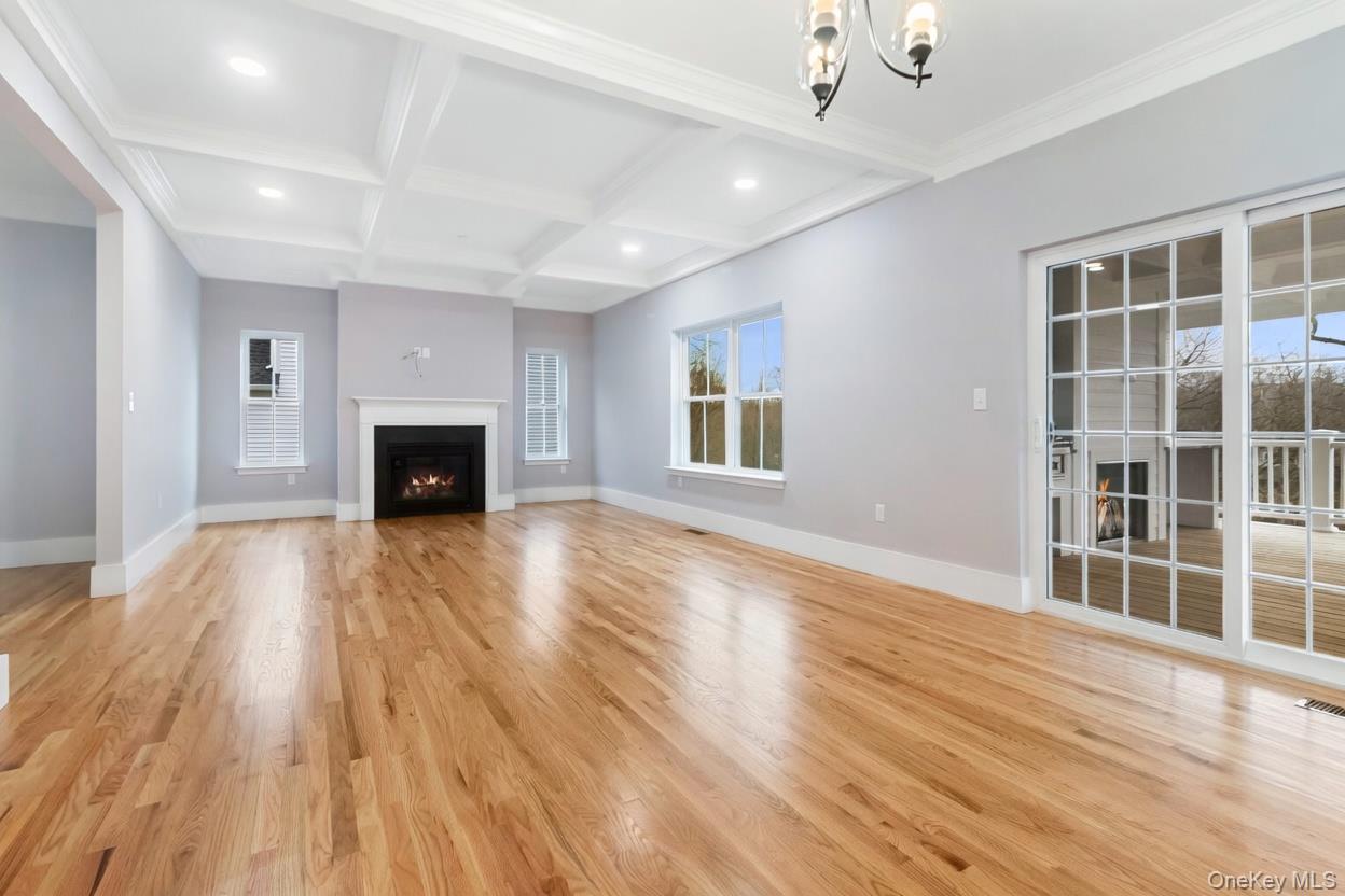 800 Sleepy Hollow Road Briarcliff Manor, NY 10510 - Photo 9 of 15 a view of empty room with wooden floor and fireplace