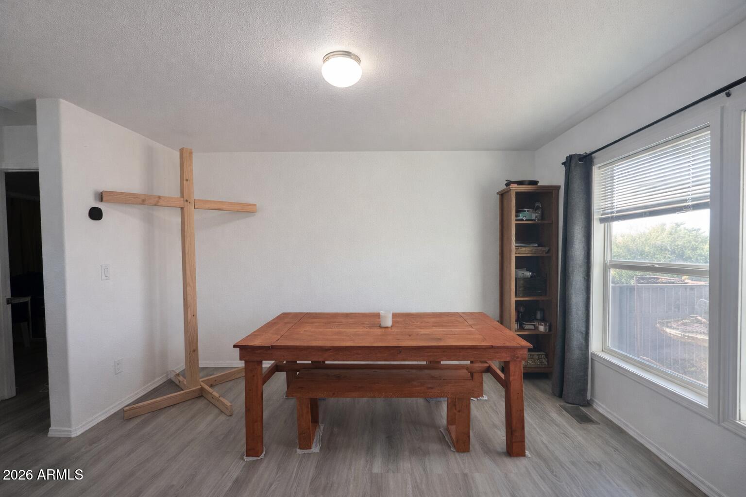 2046 South Mariposa Road Apache Junction, AZ 85119 - Photo 5 of 21 a room with furniture and wooden floor