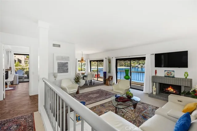 a living room with fireplace furniture and a flat screen tv