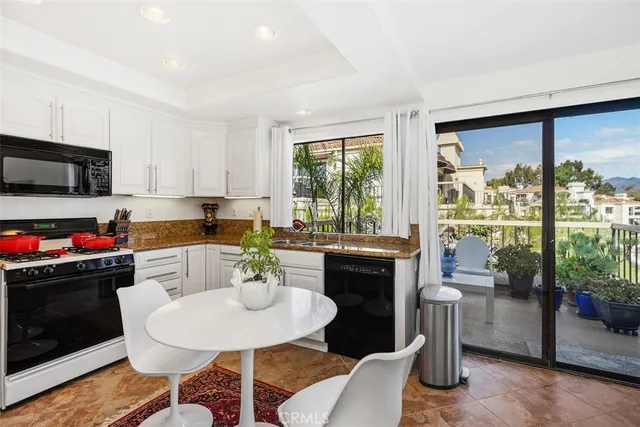 a kitchen with a table and chairs