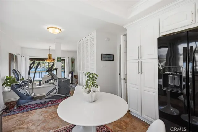a view of a livingroom with furniture and floor to ceiling window