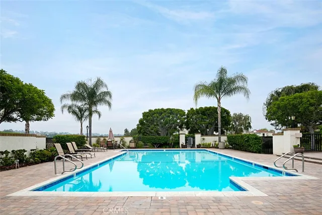 a view of a swimming pool with a patio
