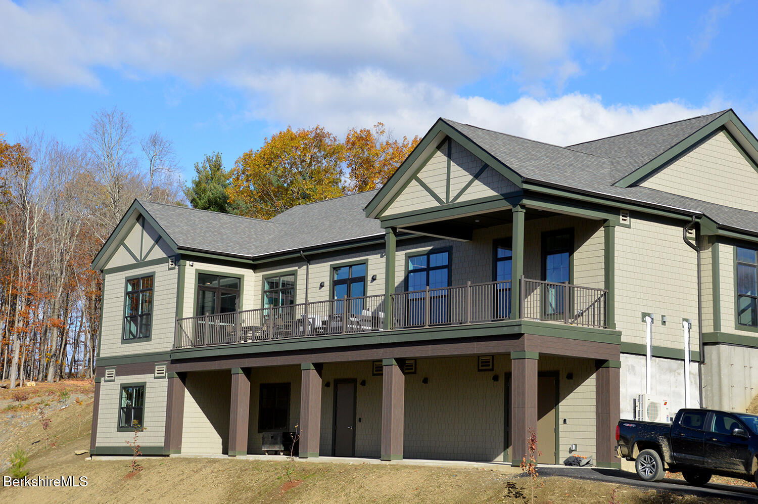 9 Brushwood Way, Unit 9 Lenox, MA 01240 - Photo 11 of 15 a front view of a house with a garden