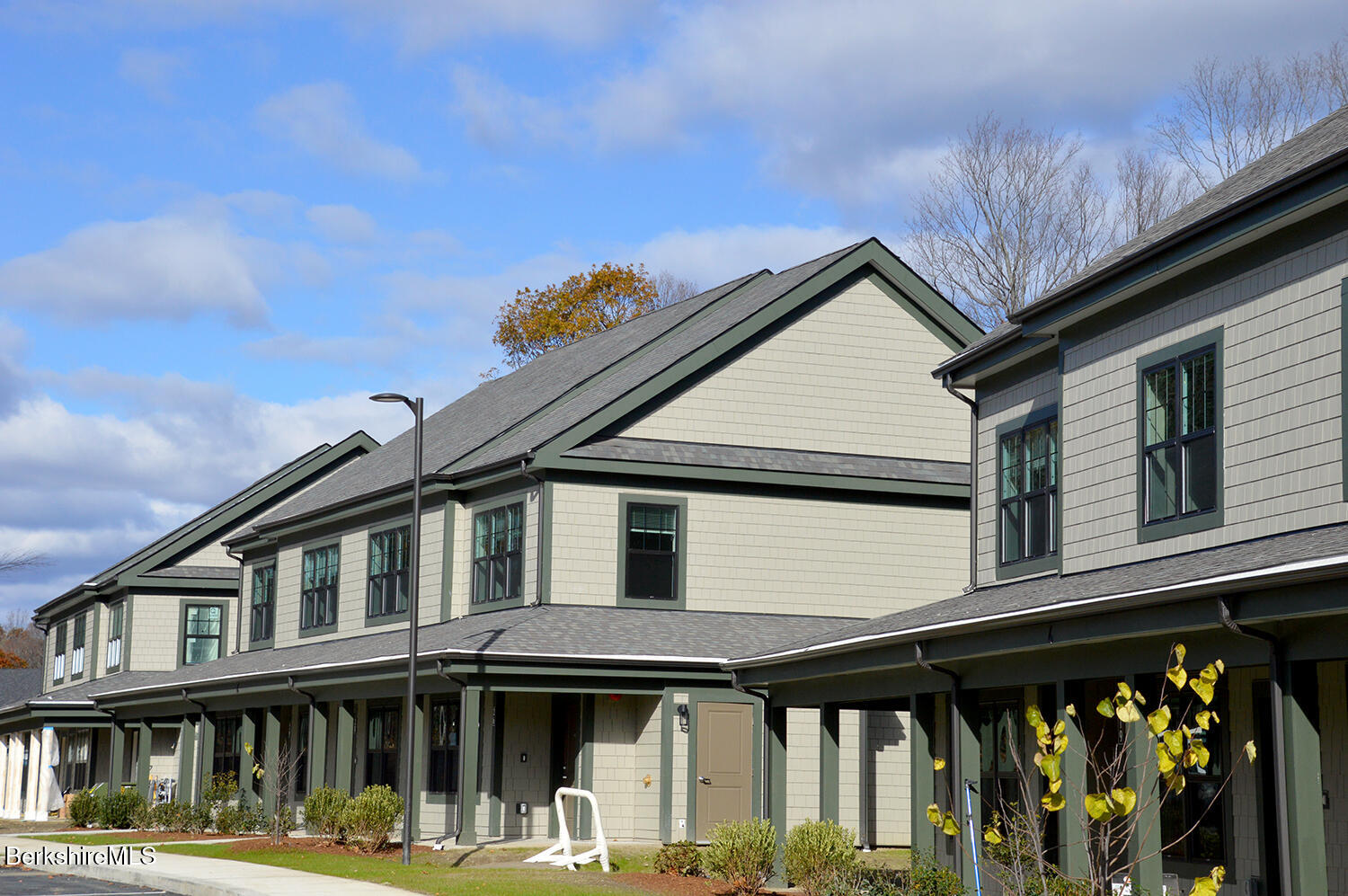 9 Brushwood Way, Unit 9 Lenox, MA 01240 - Photo 12 of 15 a front view of a house with glass windows