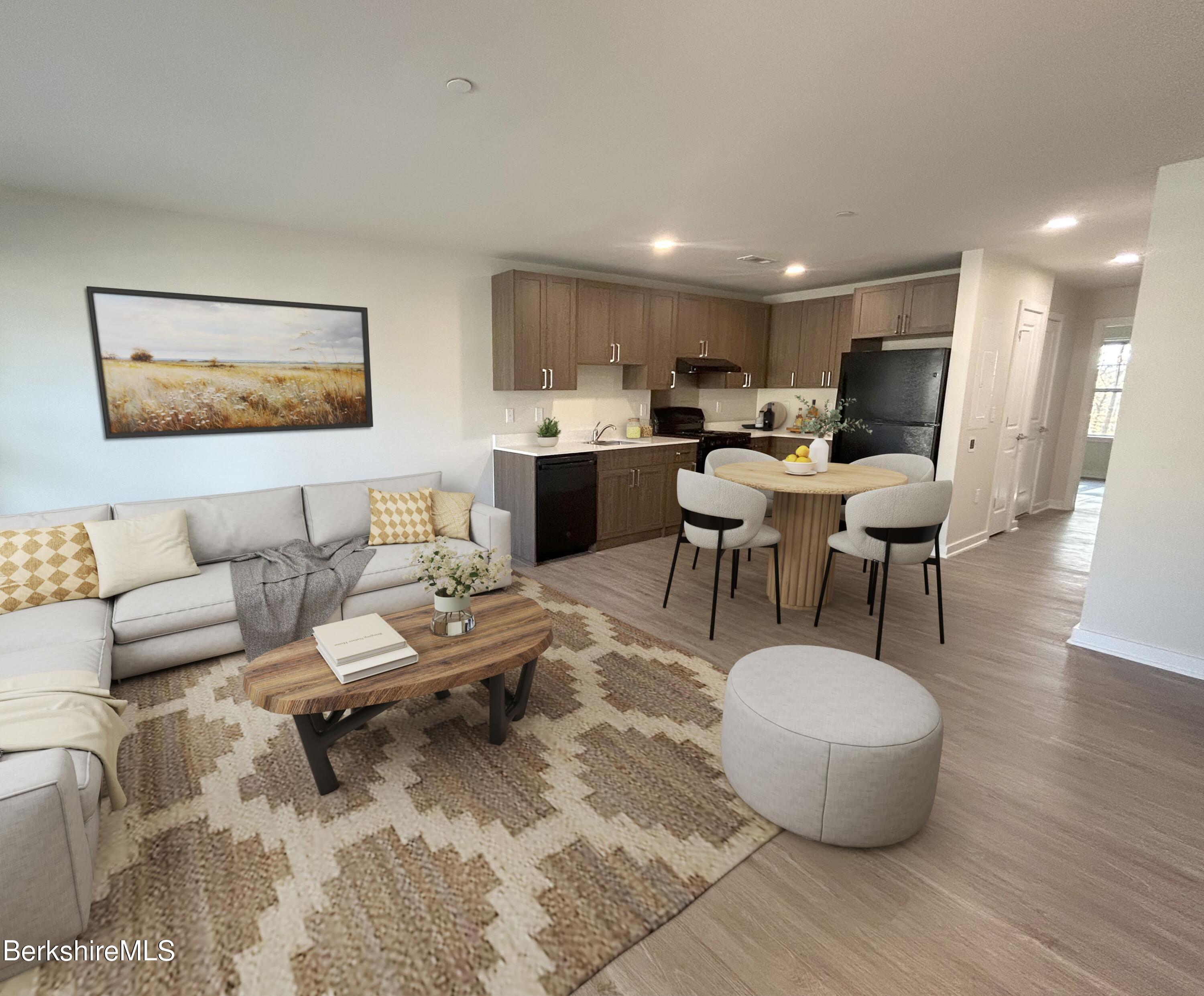 9 Brushwood Way, Unit 9 Lenox, MA 01240 - Photo 3 of 15 a living room with furniture and view of kitchen