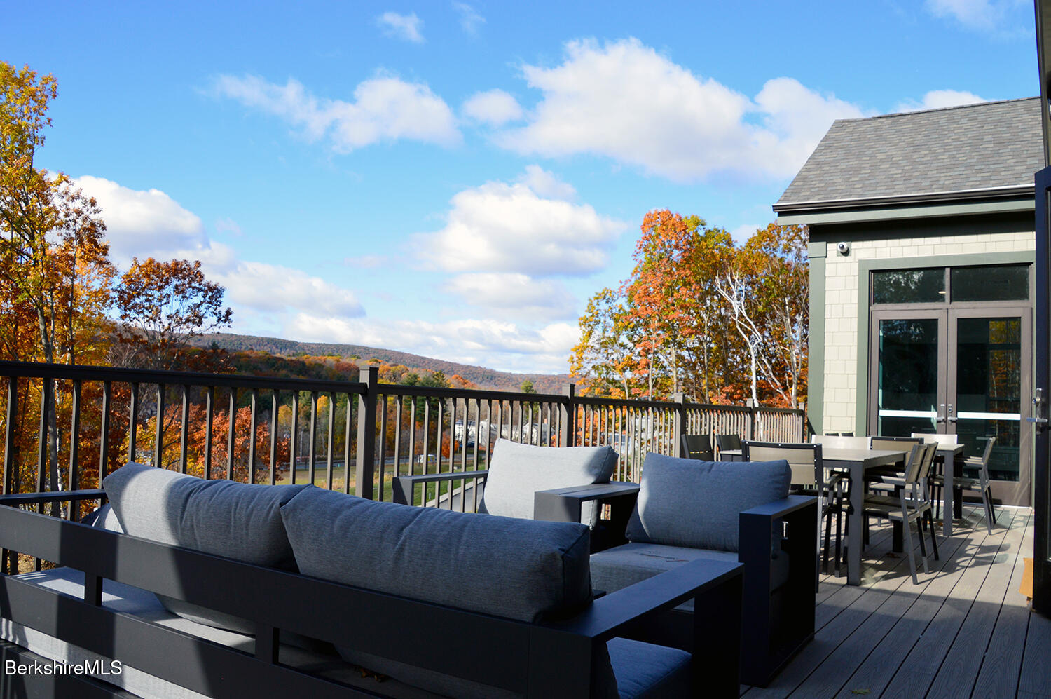 9 Brushwood Way, Unit 9 Lenox, MA 01240 - Photo 10 of 15 a balcony with table and chairs