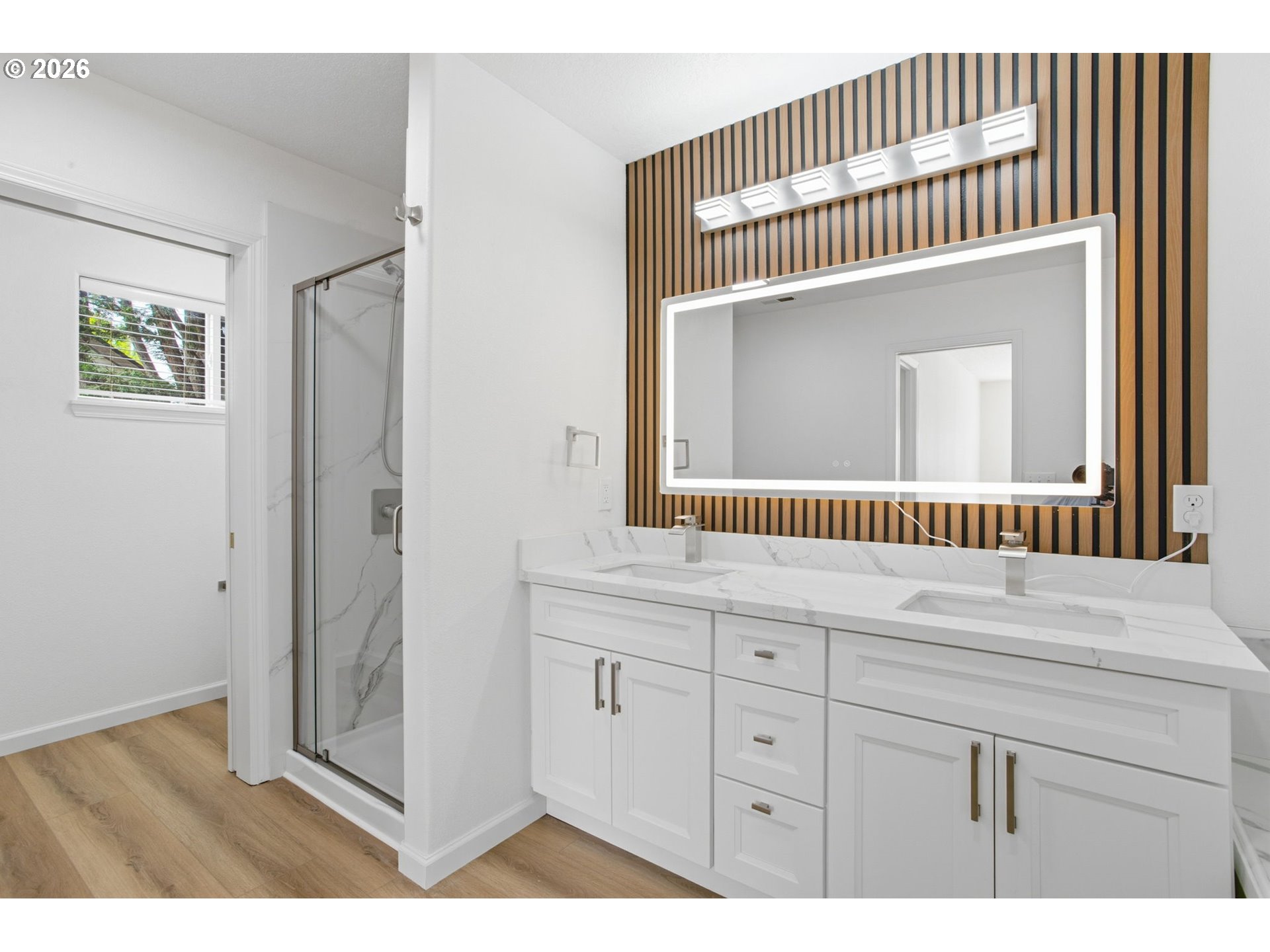 8911 Southwest Gravenstein Lane Tigard, OR 97224 - Photo 24 of 33 a bathroom with a sink a mirror and a window