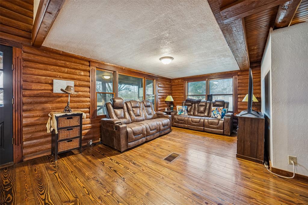 2821 Sachse Road Wylie, TX 75098 - Photo 11 of 38 a living room with furniture and a wooden floor