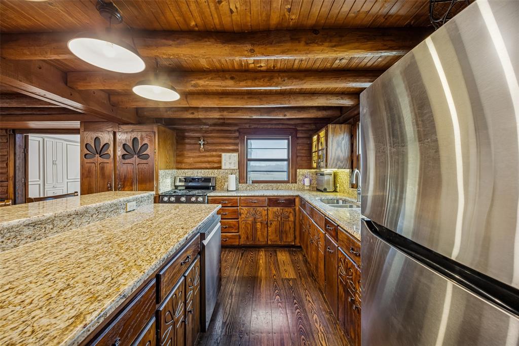 2821 Sachse Road Wylie, TX 75098 - Photo 14 of 38 a kitchen with counter top space and stainless steel appliances