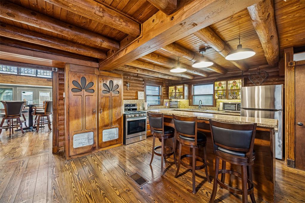 2821 Sachse Road Wylie, TX 75098 - Photo 15 of 38 a view of a dining room with furniture window and wooden floor