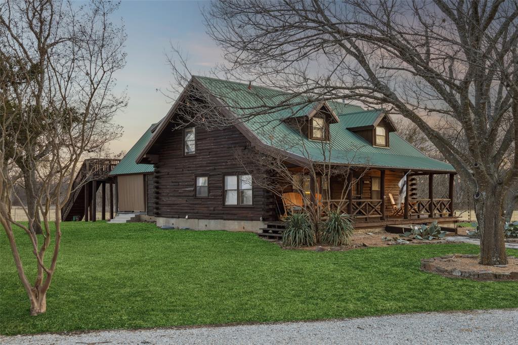2821 Sachse Road Wylie, TX 75098 - Photo 2 of 38 a front view of house with yard and green space