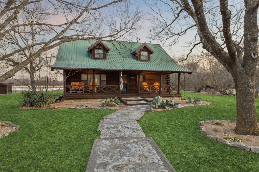 2821 Sachse Road Wylie, TX 75098 - Photo 37 of 38 a view of a park with table and chairs under a large tree