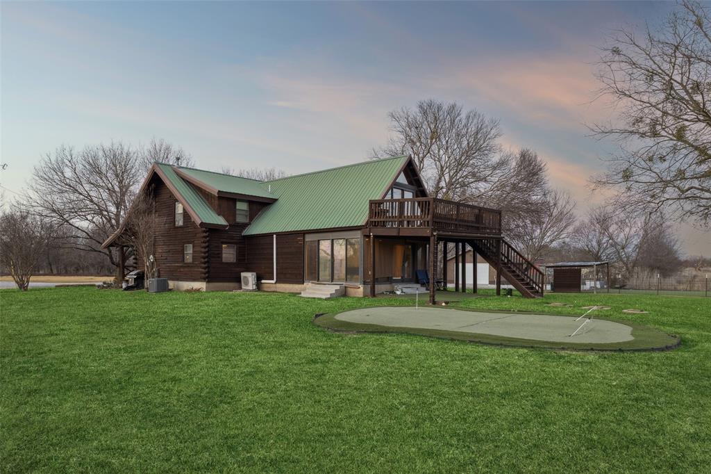 2821 Sachse Road Wylie, TX 75098 - Photo 6 of 38 a front view of a house with a garden