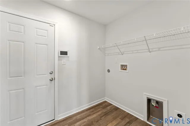 a view of a storage & utility room with wooden floor