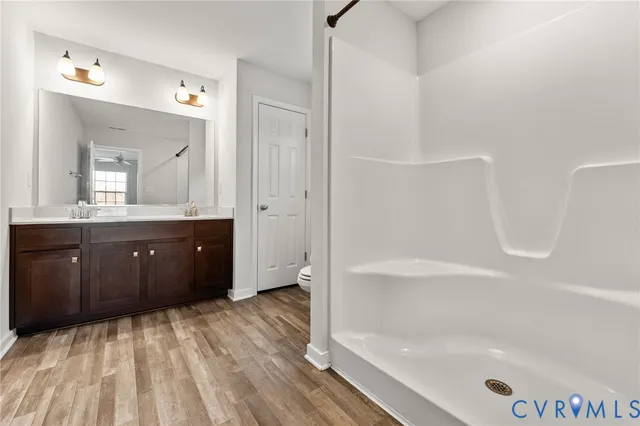 a bathroom with a bathtub sink and mirror