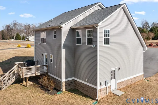 a view of backyard with a chair and swing