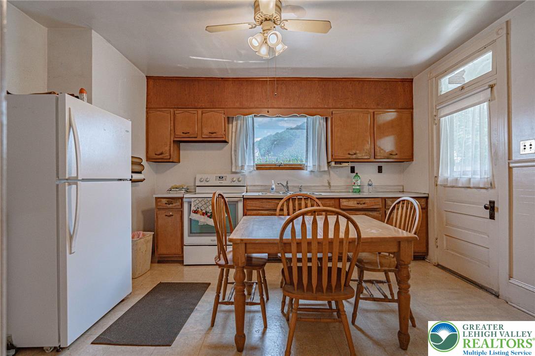 159 West Ridge Street Nesquehoning, PA 18240 - Photo 14 of 55 A functional kitchen space offers ample cabinetry and an integrated dining area with scenic views.