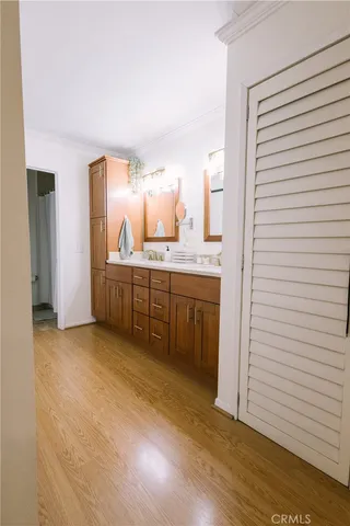 a view of a kitchen with wooden floor