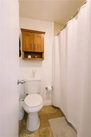 a bathroom with a toilet and a sink